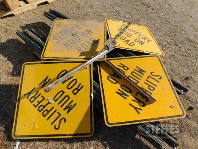 (4) "Slippery Mud on Road" signs,